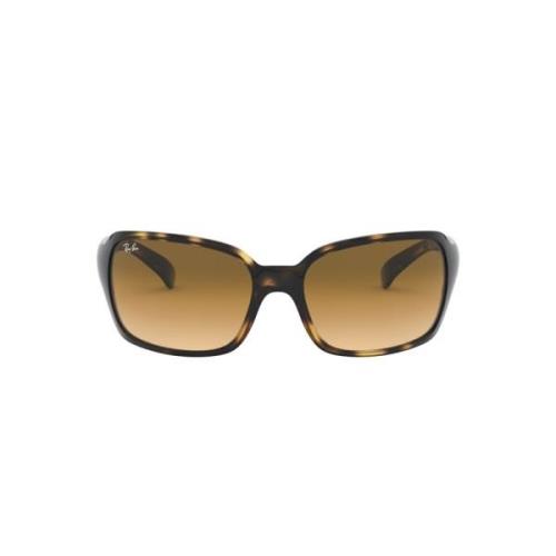 Elegante solbriller med lys Havana-ramme og brune gradientlinser