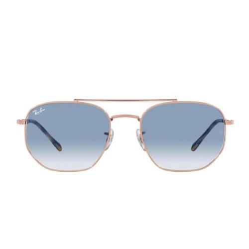 Solsbriller med uregelmæssig metalramme og blåt gradient krystalglas