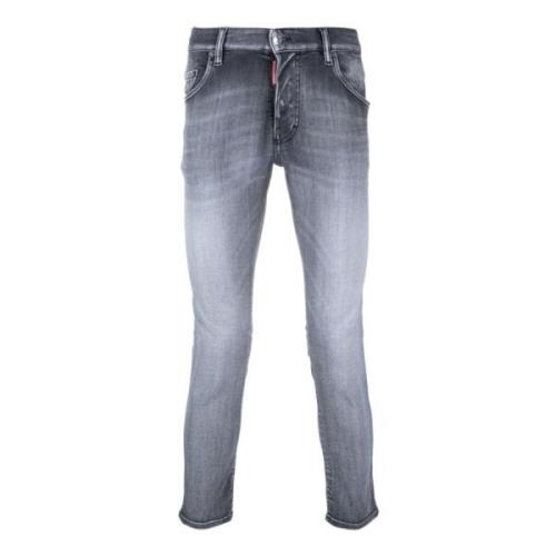 Sorte jeans med lav talje og falmet effekt