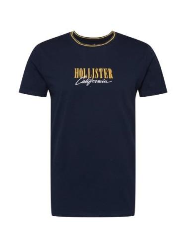 HOLLISTER Bluser & t-shirts 'VARSITY MAR'  natblå / gylden gul / hvid